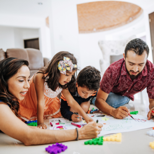 Children doing an art painting project with their parents